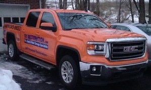 Water Damage Restoration Truck At Flooding Site