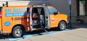 911 Water Damage Restoration Van At Exterior Of Job Location Long Island