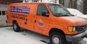 911 Water Damage Restoration Van At Winter Residential Job Site Long Island