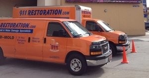 911 Water Damage Restoration Vans At Commerical Job Location Long Island